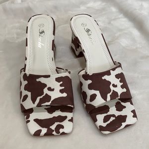 Cow print mules
